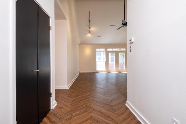 hallway with french doors and dark parquet flooring