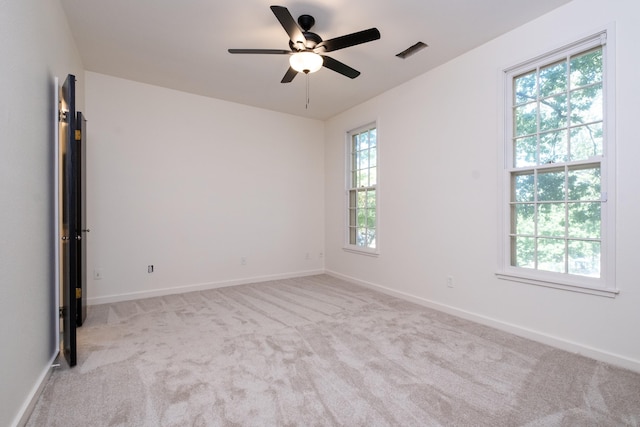 carpeted empty room with ceiling fan