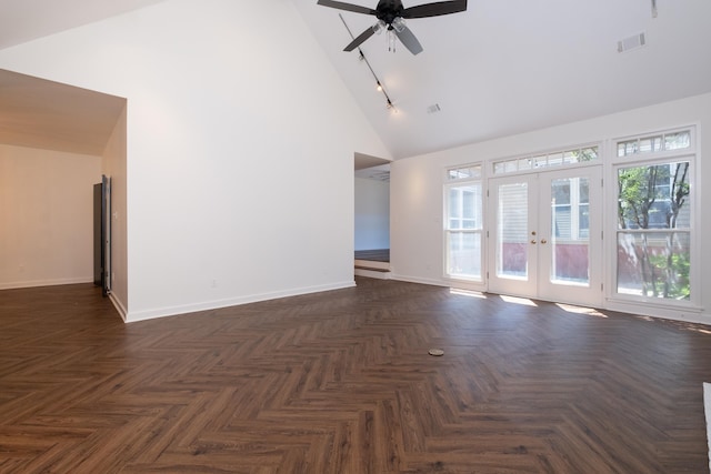 spare room featuring ceiling fan, high vaulted ceiling, track lighting, dark parquet floors, and french doors