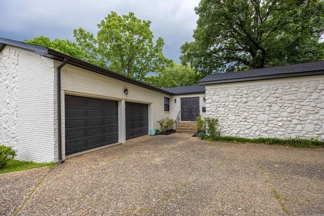 view of side of property with a garage