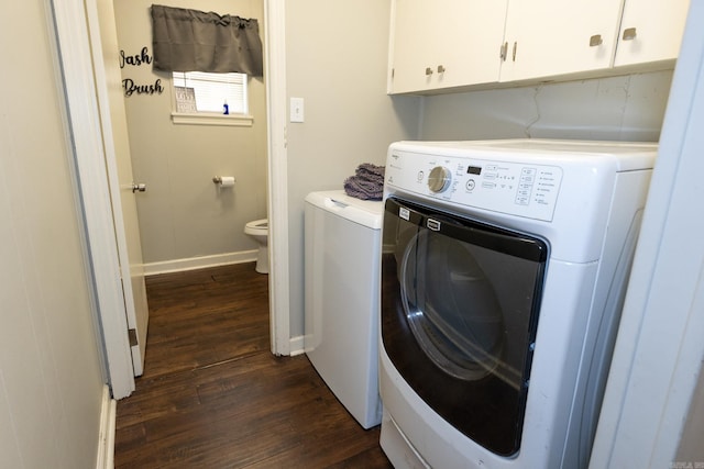 laundry room with cabinets, dark hardwood / wood-style floors, and independent washer and dryer