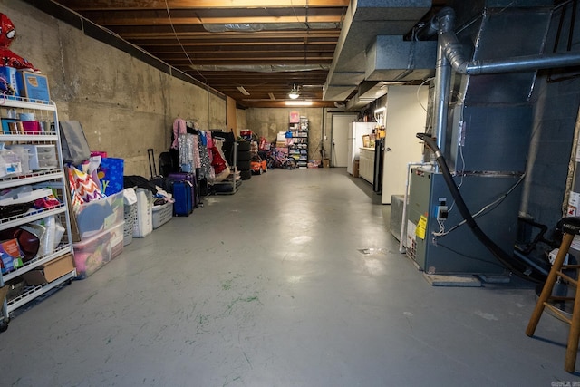 basement with white fridge