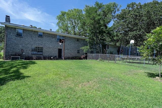 view of yard with central AC