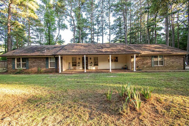 ranch-style house with a front lawn