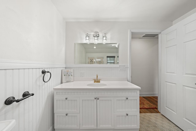 bathroom with vanity and wood-type flooring