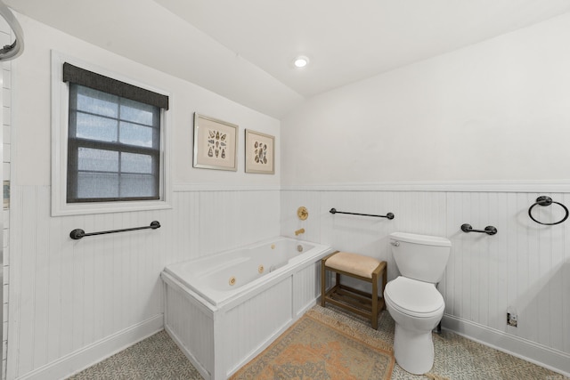 bathroom featuring a tub and toilet