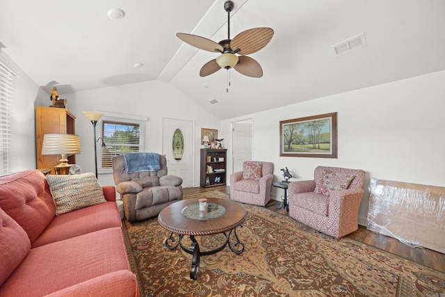 living room featuring ceiling fan, wood-type flooring, and vaulted ceiling