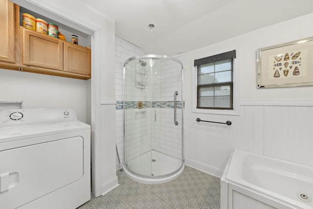 bathroom with washer / dryer, tile patterned floors, and separate shower and tub