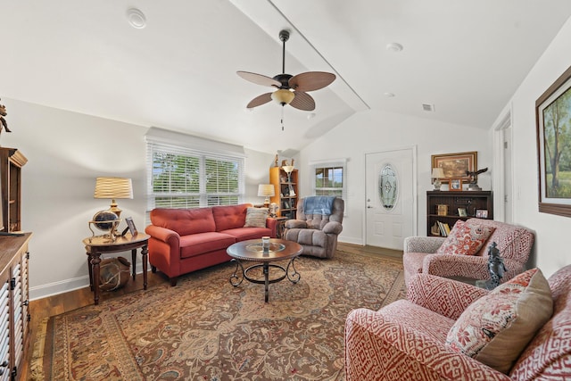 living room with lofted ceiling, hardwood / wood-style flooring, and ceiling fan