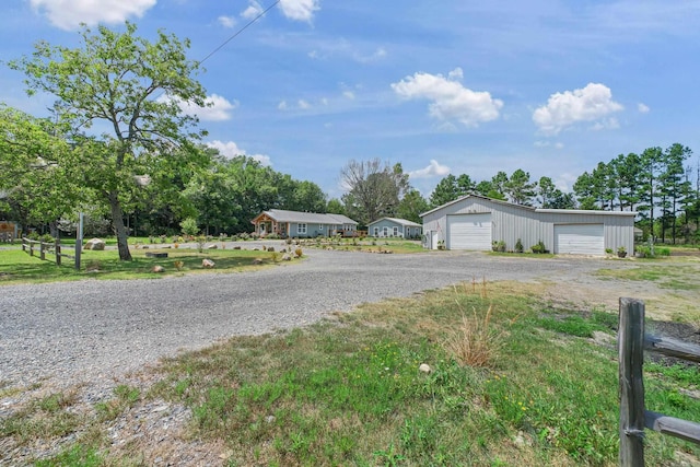 view of front of house featuring an outbuilding and a garage