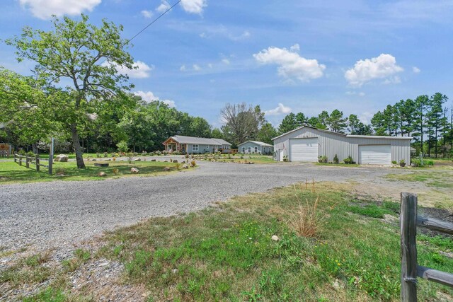 2911 Polk Rd 54, Mena, AR 71953 - view of front of property with a garage and an outdoor structure