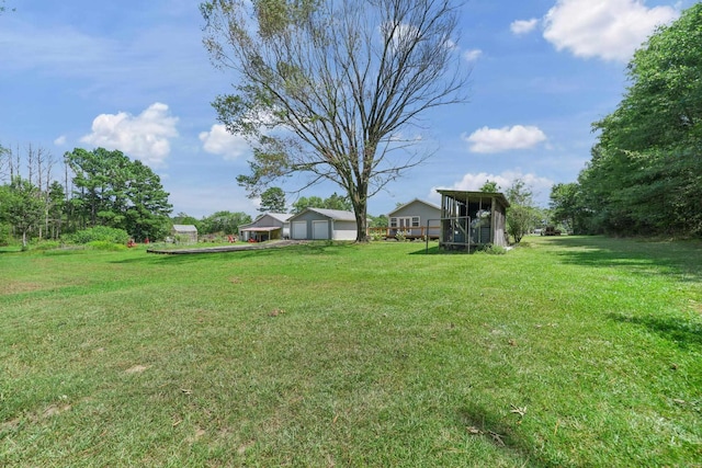 view of yard featuring a garage