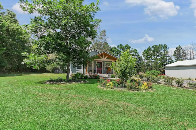 2911 Polk Rd 54, Mena, AR 71953 - view of grassy yard with covered porch
