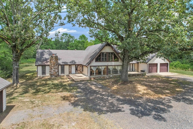 view of front of house with a garage and covered porch