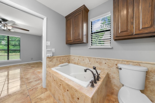 bathroom featuring a wealth of natural light, tile patterned floors, ceiling fan, and toilet