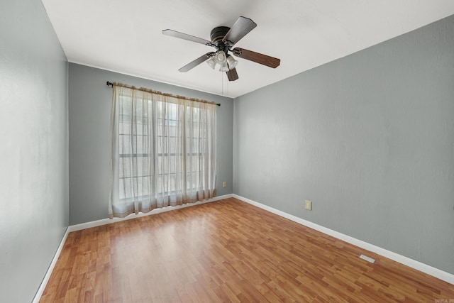 unfurnished room featuring ceiling fan and light hardwood / wood-style floors