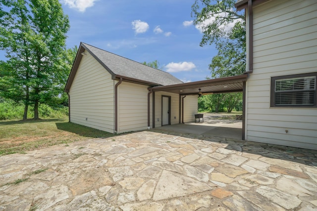 exterior space featuring ceiling fan