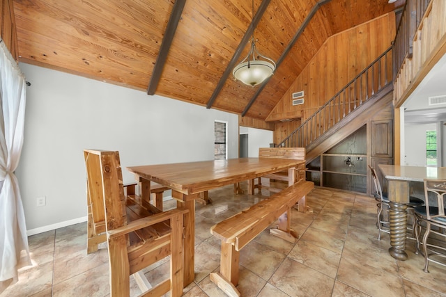 dining area with light tile patterned flooring, wooden ceiling, and high vaulted ceiling