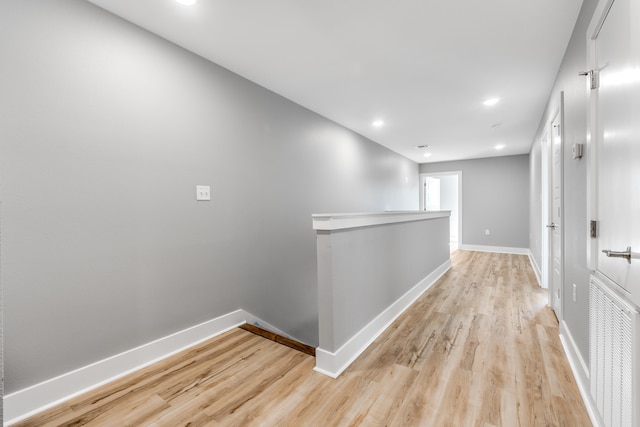 hall with light hardwood / wood-style floors