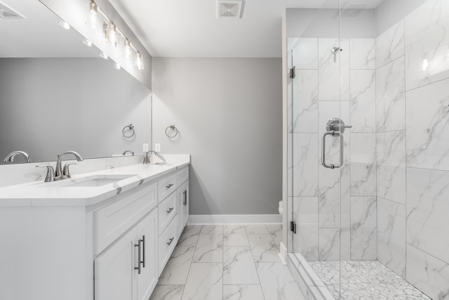 bathroom with vanity, toilet, and a shower with shower door