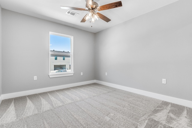 carpeted empty room with ceiling fan