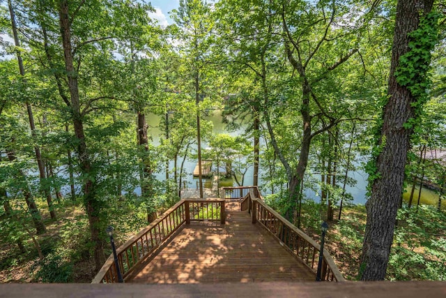 wooden terrace featuring a water view