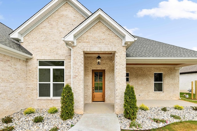 entrance to property featuring a patio