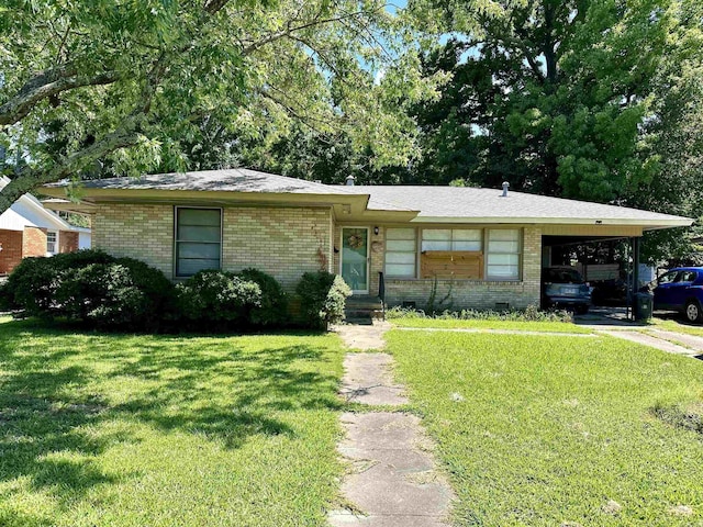 single story home with a front yard and a carport