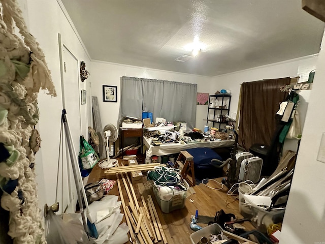 miscellaneous room featuring hardwood / wood-style floors and a textured ceiling