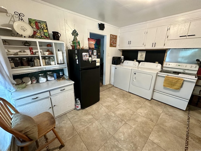 washroom featuring separate washer and dryer, light tile patterned floors, and ornamental molding