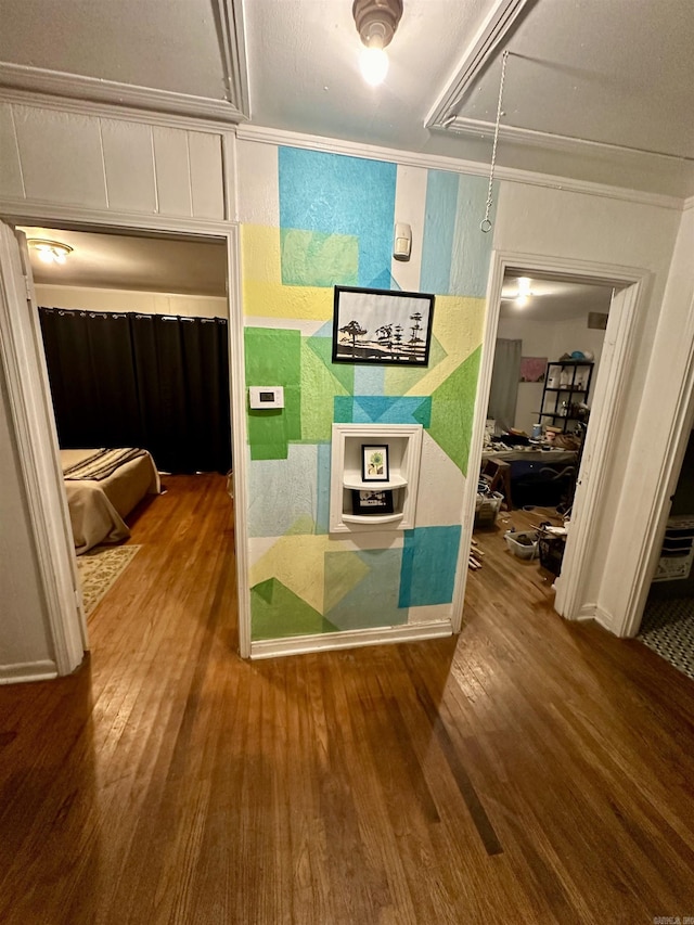 corridor with hardwood / wood-style floors