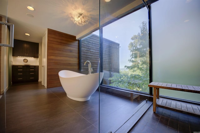 bathroom featuring tile patterned flooring and a tub