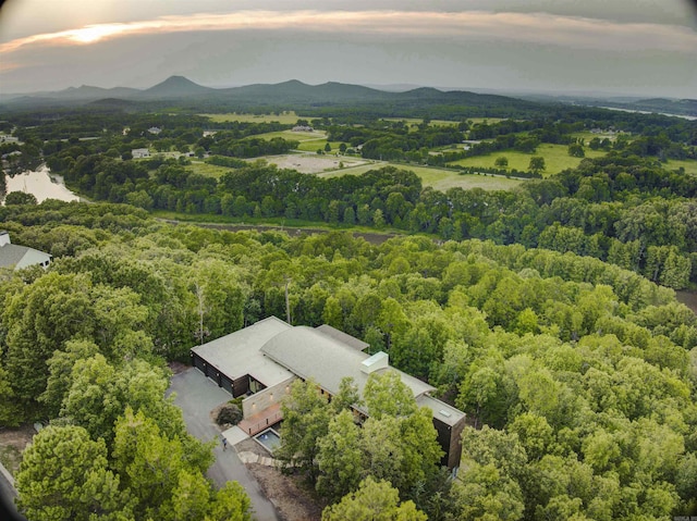 aerial view at dusk featuring a mountain view