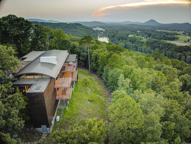 aerial view at dusk featuring a mountain view