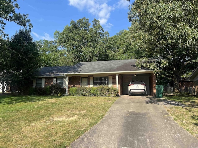 single story home featuring a garage and a front yard