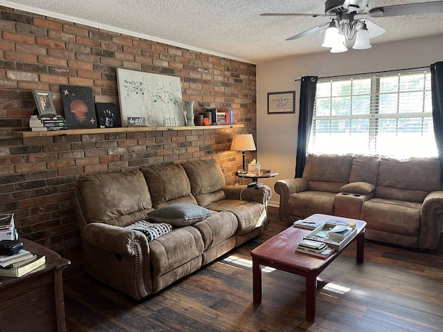 living area with a textured ceiling, ceiling fan, and dark wood-type flooring