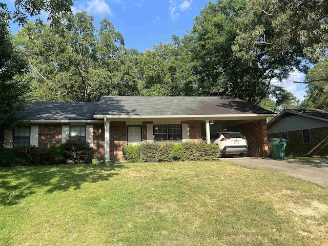 ranch-style home with a carport and a front yard