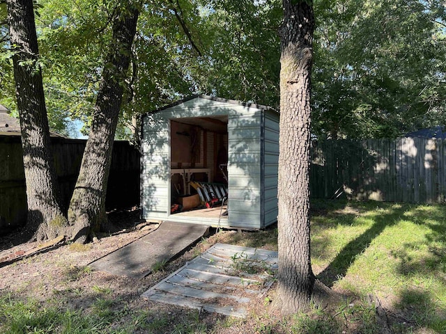 view of shed featuring a fenced backyard