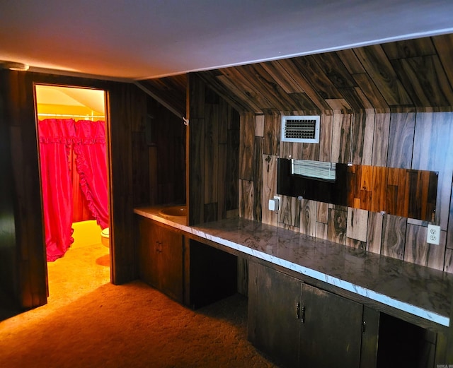 interior space with carpet flooring and dark brown cabinets