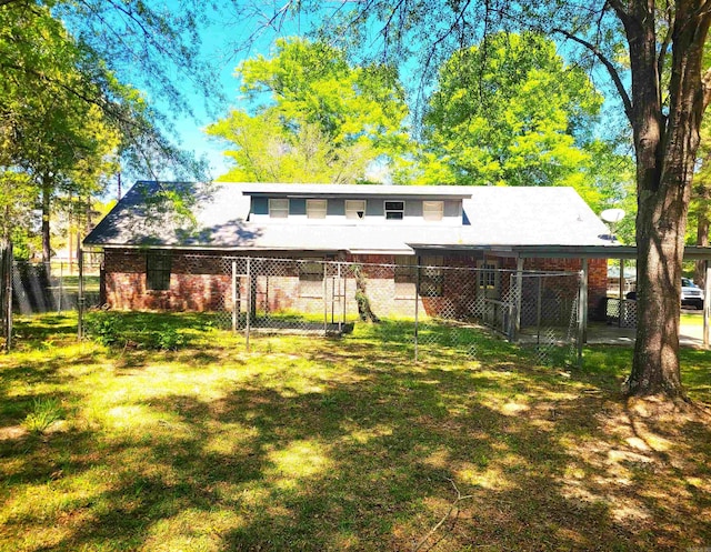 back of house with a yard