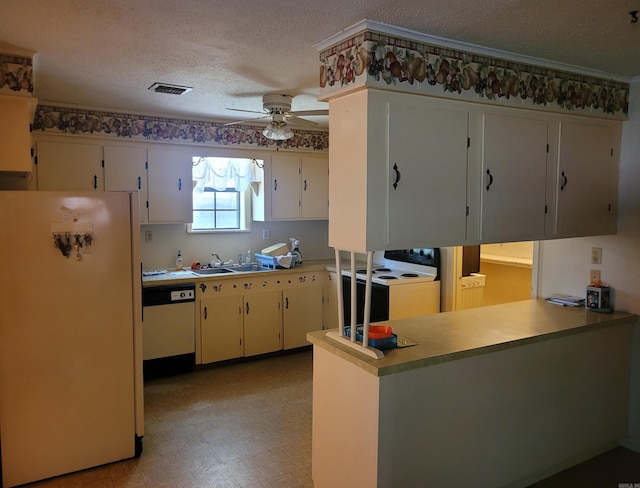 kitchen featuring ceiling fan, light parquet flooring, white appliances, a textured ceiling, and kitchen peninsula