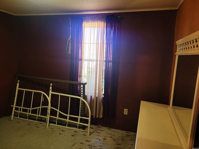 bedroom with carpet and crown molding