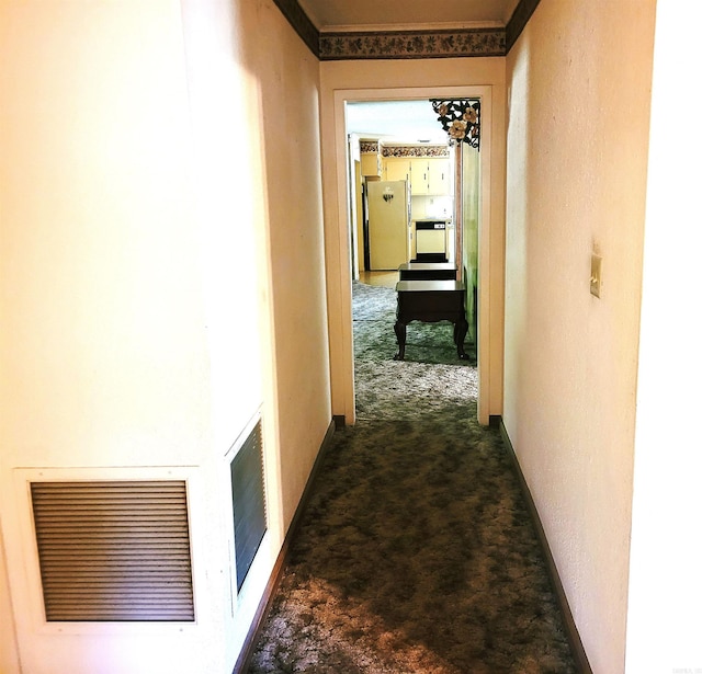 corridor featuring dark carpet