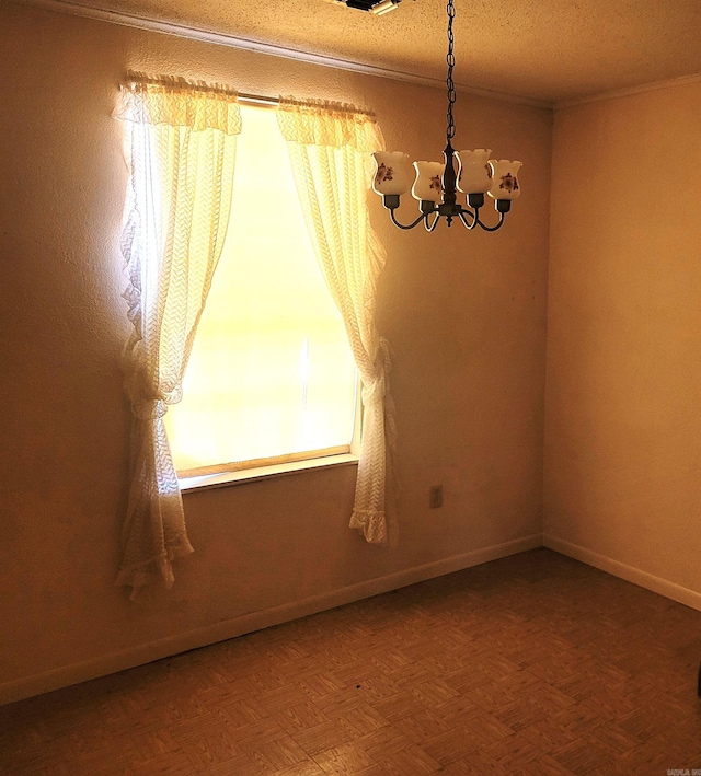 unfurnished room with an inviting chandelier, parquet floors, and a textured ceiling