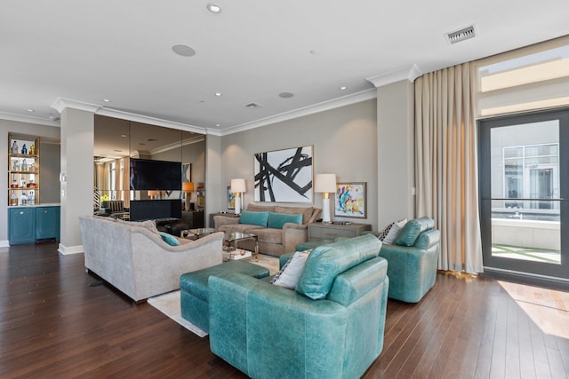 living room with crown molding and dark hardwood / wood-style floors