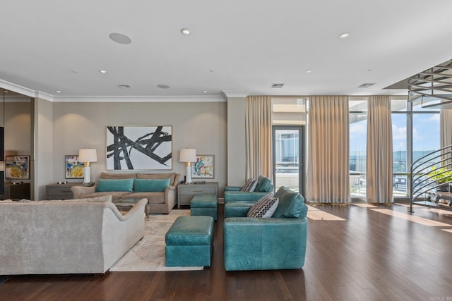 living room with floor to ceiling windows, crown molding, and hardwood / wood-style floors