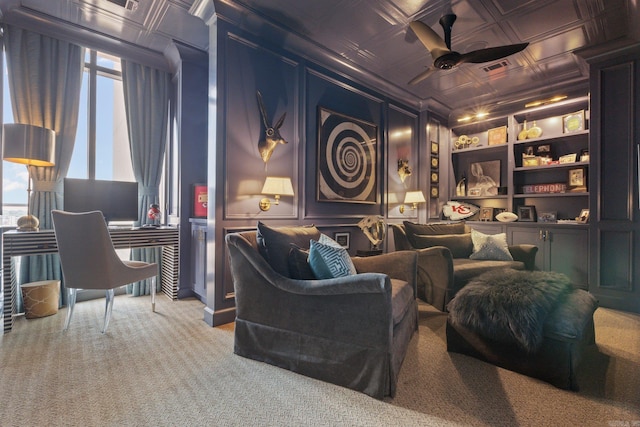 interior space featuring ceiling fan, carpet, built in shelves, and coffered ceiling