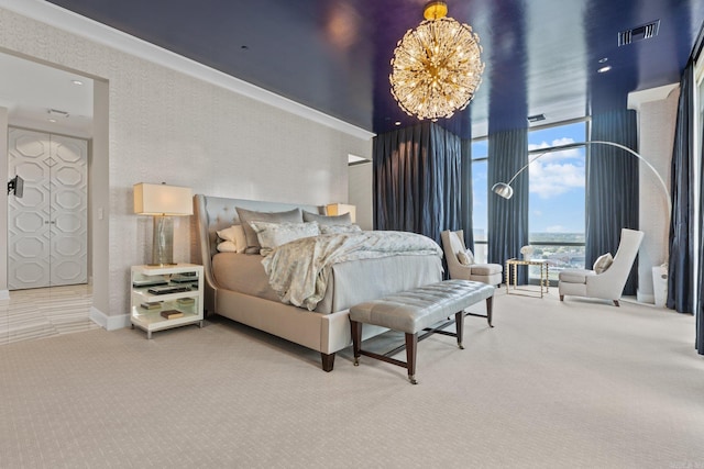 bedroom featuring a notable chandelier, a wall of windows, and carpet floors