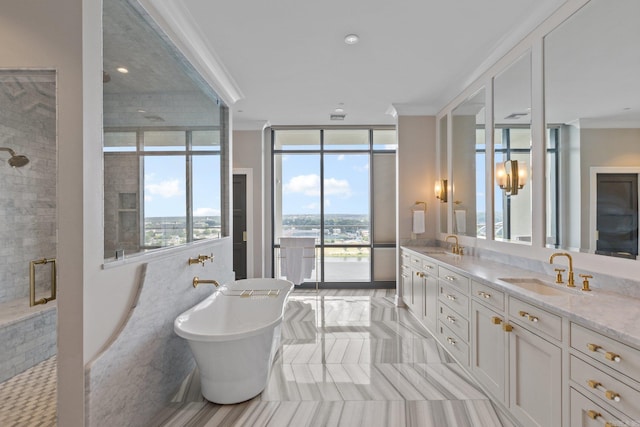 bathroom featuring tile patterned flooring, crown molding, plenty of natural light, and dual bowl vanity