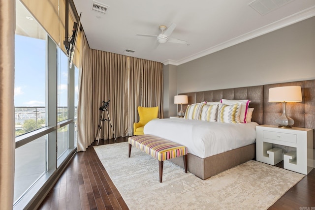 bedroom with ceiling fan, ornamental molding, dark wood-type flooring, access to exterior, and floor to ceiling windows